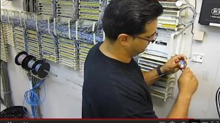 Alberto Luna, shown here terminating a UTP cable, was named 2012 Cabling Icon.