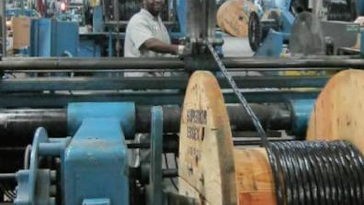 Respooling a cable from a large reel to a smaller reel, as shown here, is just one of several costs that a manufacturer or distributor incurs when accommodating a request for a custom-length cable.