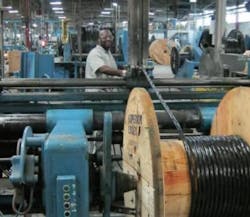 Respooling a cable from a large reel to a smaller reel, as shown here, is just one of several costs that a manufacturer or distributor incurs when accommodating a request for a custom-length cable. Respooling a cable from a large reel to a smaller reel, as shown here, is just one of several costs that a manufacturer or distributor incurs when accommodating a request for a custom-length cable.