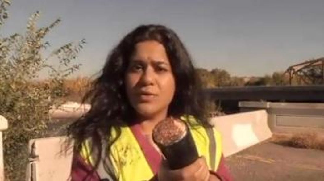 KIMA TV reporter Samina Engel holds a section of the copper cable that was stolen from a CenturyLink network in Yakima, WA.