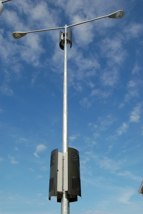 Metro cell concealment solution mounts, hides equipment on street poles