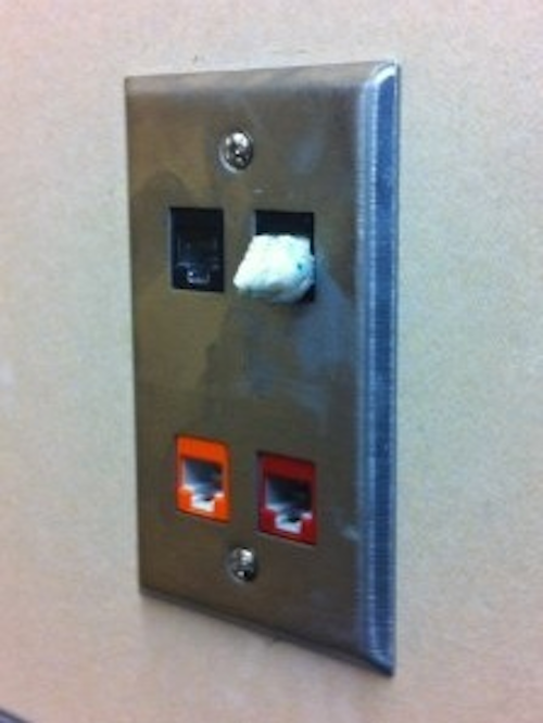 In this photo taken by Siemon Company, a network port in an elementary school is stuffed with gum. Siemon wants to hear about the worst thing you've ever seen stuck in a network port.