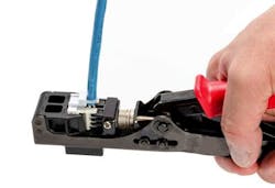 HellermannTyton&apos;s single-action jack termination tool cuts and terminates all eight wires with one squeeze of the handle.