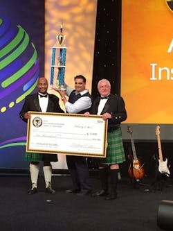 Flanked by BICSI president Michael Collins (left) and BICSI CEO/executive director John D. Clark (right), Alberto Luna hoists the trophy he earned by winning the BICSI Installer of the Year award. Luna, who won a $5,000 cash prize as Installer of the Year, previously was named the season two Cabling Icon. For that honor, he also won a cash prize in excess of $5,000 and an expenses-paid trip to the 2013 BICSI Winter Conference. It was at the 2013 Winter Conference that Luna first participated in the BICSI Cabling Skills Challenge. Flanked by BICSI president Michael Collins (left) and BICSI CEO/executive director John D. Clark (right), Alberto Luna hoists the trophy he earned by winning the BICSI Installer of the Year award. Luna, who won a $5,000 cash prize as Installer of the Year, previously was named the season two Cabling Icon. For that honor, he also won a cash prize in excess of $5,000 and an expenses-paid trip to the 2013 BICSI Winter Conference. It was at the 2013 Winter Conference that Luna first participated in the BICSI Cabling Skills Challenge.