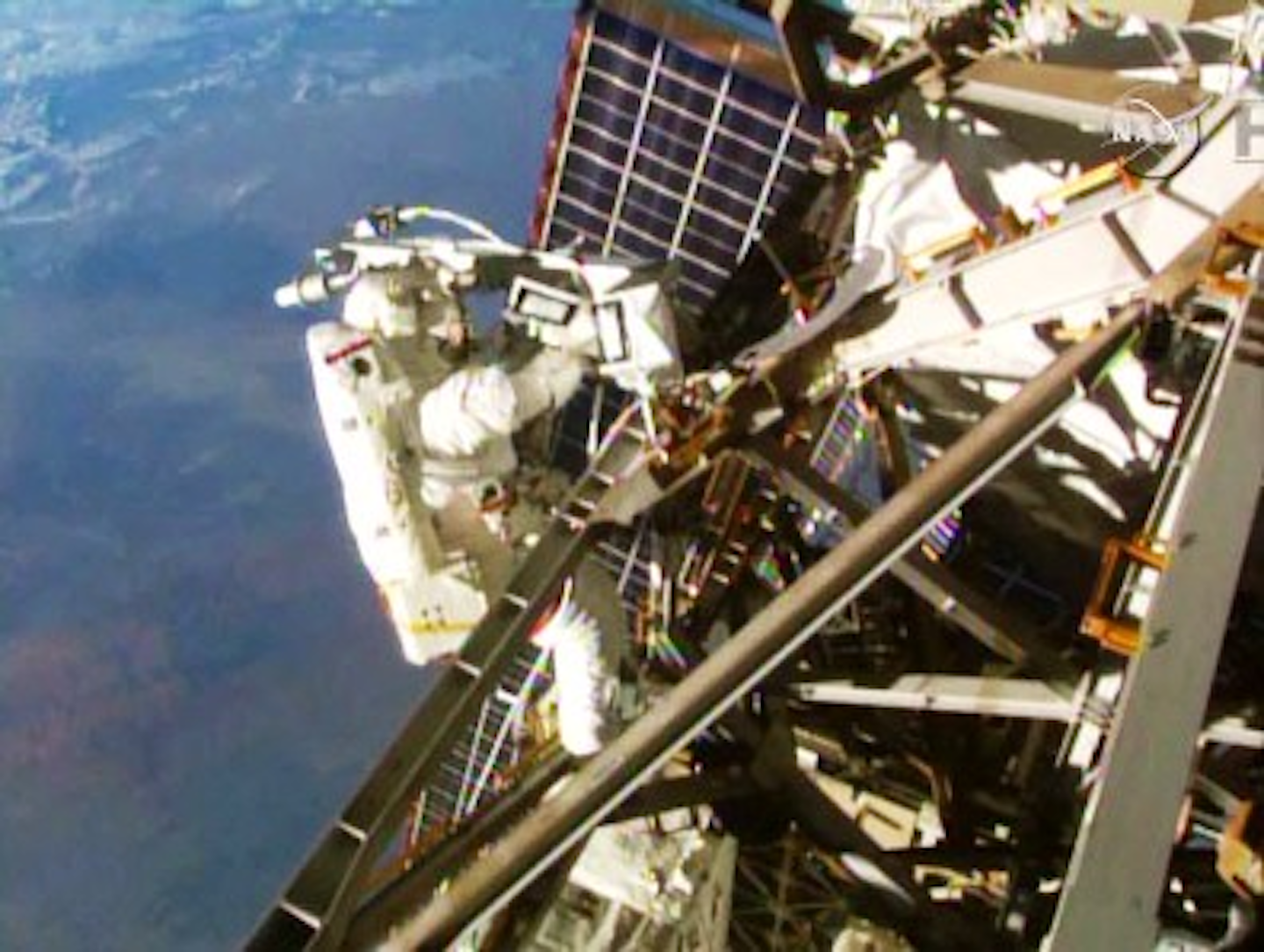 Astronauts perform cable installation on International Space Station ...