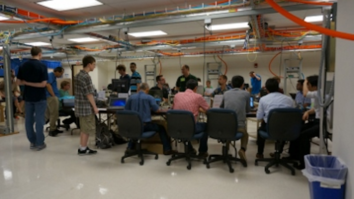 Technical experts gather and collaborate at the University of New Hampshire's InterOperability Laboratory in June 2015. The UNH-IOL hosted a 25-Gbit/sec technical feasibility event in conjunction with a 40/100-Gbit/sec plugfest, both organized by the Ethernet Alliance, in June. 25GbE cabling and networking equipment achieved a promising better-than-86-percent success rate in all test cases performed.