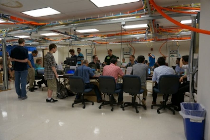 Technical experts gather and collaborate at the University of New Hampshire&apos;s InterOperability Laboratory in June 2015. The UNH-IOL hosted a 25-Gbit/sec technical feasibility event in conjunction with a 40/100-Gbit/sec plugfest, both organized by the Ethernet Alliance, in June. 25GbE cabling and networking equipment achieved a promising better-than-86-percent success rate in all test cases performed.