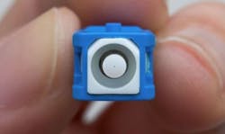 A fiber-optic connector endface like this one can be contaminated in a number of ways. In an instructional video, Sticklers points out that a static charge can lead to contamination by attracting dust.