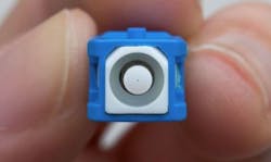 A fiber-optic connector endface like this one can be contaminated in a number of ways. In an instructional video, Sticklers points out that a static charge can lead to contamination by attracting dust. A fiber-optic connector endface like this one can be contaminated in a number of ways. In an instructional video, Sticklers points out that a static charge can lead to contamination by attracting dust.
