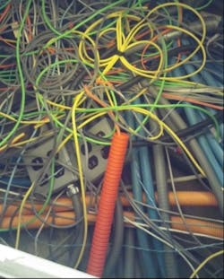 Through proper cable labeling, administration, and with the help of DCIM, network administrators can avoid a spaghetti effect like this one. Through proper cable labeling, administration, and with the help of DCIM, network administrators can avoid a spaghetti effect like this one.