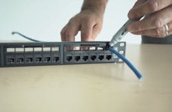 One of the attributes of Belden's REVConnect Preloaded Patch Panels is that the technician can use the space over each port to mark the cable where it should be terminated. Technicians also can use that above-the-port space to organize and dress cables, and measure the slack needed. One of the attributes of Belden's REVConnect Preloaded Patch Panels is that the technician can use the space over each port to mark the cable where it should be terminated. Technicians also can use that above-the-port space to organize and dress cables, and measure the slack needed.