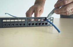 One of the attributes of Belden's REVConnect Preloaded Patch Panels is that the technician can use the space over each port to mark the cable where it should be terminated. Technicians also can use that above-the-port space to organize and dress cables, and measure the slack needed. One of the attributes of Belden's REVConnect Preloaded Patch Panels is that the technician can use the space over each port to mark the cable where it should be terminated. Technicians also can use that above-the-port space to organize and dress cables, and measure the slack needed.