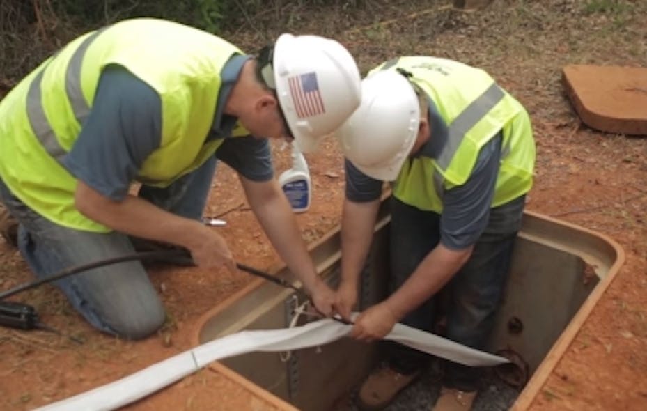 Installers place MaxCell fabric innerduct into an underground conduit. Successfully navigating congested conduit space will be a key element of preparing for 5G.