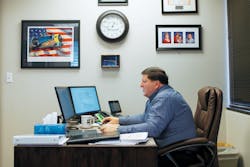 Glenn Sexton, former CEO and now Principal Consultant with NIS Consulting, works at his desk in the firm's Beaverton, OR headquarters. NIS serves customers throughout the United States, and Sexton has gone to cities across the continent as part of the Telecommunications Industry Association's cabling-standards development committee. Glenn Sexton, former CEO and now Principal Consultant with NIS Consulting, works at his desk in the firm's Beaverton, OR headquarters. NIS serves customers throughout the United States, and Sexton has gone to cities across the continent as part of the Telecommunications Industry Association's cabling-standards development committee.