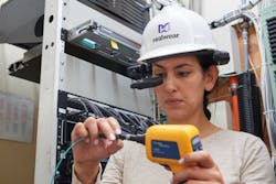 At the BICSI Fall Exhibition, Fluke Networks demonstrated a prototype setup in which it paired its FI-3000 FiberInspector Pro MPO camera with a RealWear HMT-1 wearable rugged Android tablet. At the BICSI Fall Exhibition, Fluke Networks demonstrated a prototype setup in which it paired its FI-3000 FiberInspector Pro MPO camera with a RealWear HMT-1 wearable rugged Android tablet.