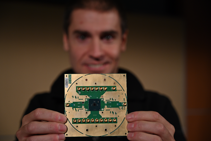 Stefano Pellerano, principal engineer at Intel Labs, holds Horse Ridge. The new cryogenic control chip will speed development of full-stack quantum computing systems, marking a milestone in the development of a commercially viable quantum computer.