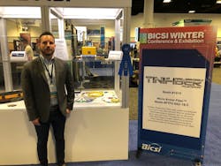 Robert Cochrane, National Specialist for TiniFiber, proudly stands in front of the company&apos;s 1st place ribbon at the BICSI 2020 Winter show.