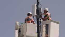 In Indianapolis, IN, Verizon technicians install a 5G node. 5G's ultra low latency promises to enable technological advancement across consumer and enterprise applications. In Indianapolis, IN, Verizon technicians install a 5G node. 5G's ultra low latency promises to enable technological advancement across consumer and enterprise applications.