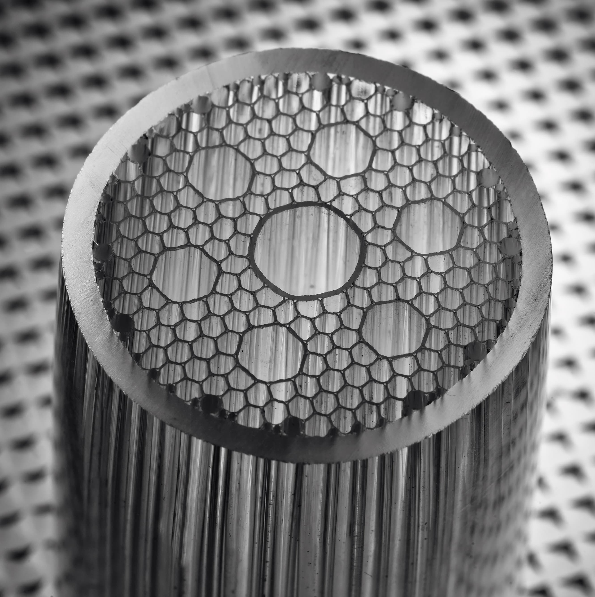 As noted by OFS, light travels about 50% faster in a hollow core compared to a solid silica core of conventional optical fiber.
