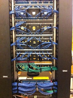 A typically busy patch panel organized and outfitted with Secure RJ45 connectors A typically busy patch panel organized and outfitted with Secure RJ45 connectors