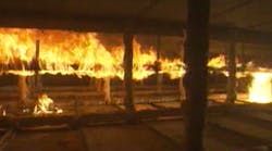 This image, taken from video footage of a test conducted at a nationally recognized test laboratory, shows flame spreading through a plenum space, fueled by cable that is not plenum-rated.