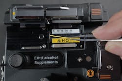 Remove fiber chards and fiber jacket debris. Remove fiber chards and fiber jacket debris.