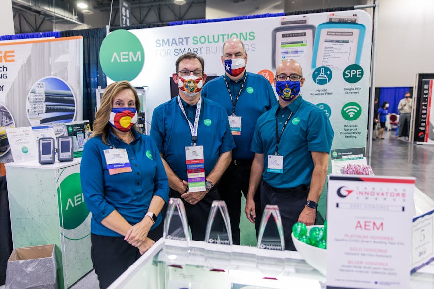 The team at AEM poses behind their three Cabling Innovators Awards at the BICSI Fall 2021 Conference and Exhibition.