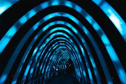 An illuminated tunnel, formed from arches representing a whale’s ribs and transmitting the dynamic echoing of whale songs, is connected to the optical LAN. An illuminated tunnel, formed from arches representing a whale’s ribs and transmitting the dynamic echoing of whale songs, is connected to the optical LAN.