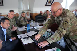 Chief Warrant Officer 5 Andrew Foreman, U.S. Army Europe and Africa G6 Chief Technology Officer, demonstrates LiFi technology as part of the 2d Theater Signal Brigade's LiFi exhibition event Aug. 11, 2021 at USAG Wiesbaden.
