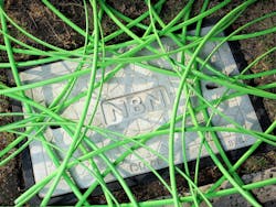 Green NBN fiber-optic cable in an unstructured condition over a pit with a utility hole cover displaying the NBN word mark in Melbourne, Australia. Green NBN fiber-optic cable in an unstructured condition over a pit with a utility hole cover displaying the NBN word mark in Melbourne, Australia.