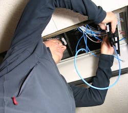 Matthew Conger director of sales with SDS connecting and testing the IGOR nodes located in hallway panels for the guest rooms to provide PoE power and control to all the lights and shades. Matthew Conger director of sales with SDS connecting and testing the IGOR nodes located in hallway panels for the guest rooms to provide PoE power and control to all the lights and shades.