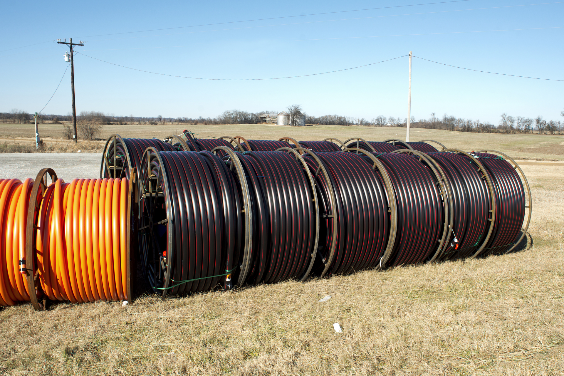 Fiber-optic cable waiting for deployment in a rural area.