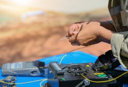 technician_cutting__fusing_fiber_optic_cables technician_cutting__fusing_fiber_optic_cables