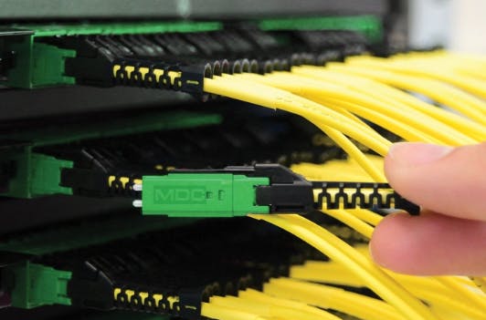 US Conec holds multiple patents associated with its MDC Connector, shown here. The company recently asserted its rights to patents associated with the MDC and other connectors, by filing a complaint with the International Trade Commission and a federal lawsuit in the Eastern District of Texas.
