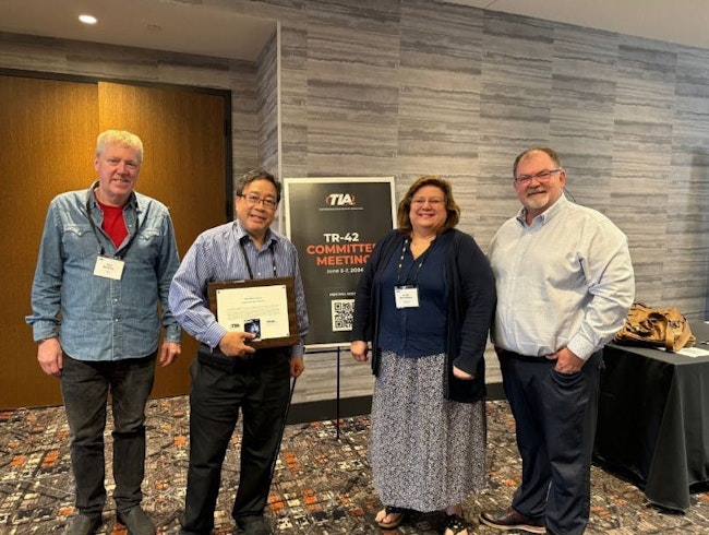 Jonathan Jew, second from left, receives the TIA's Lifetime Achievement Award during the TR-42 Committee meeting held June 3-7, 2024.