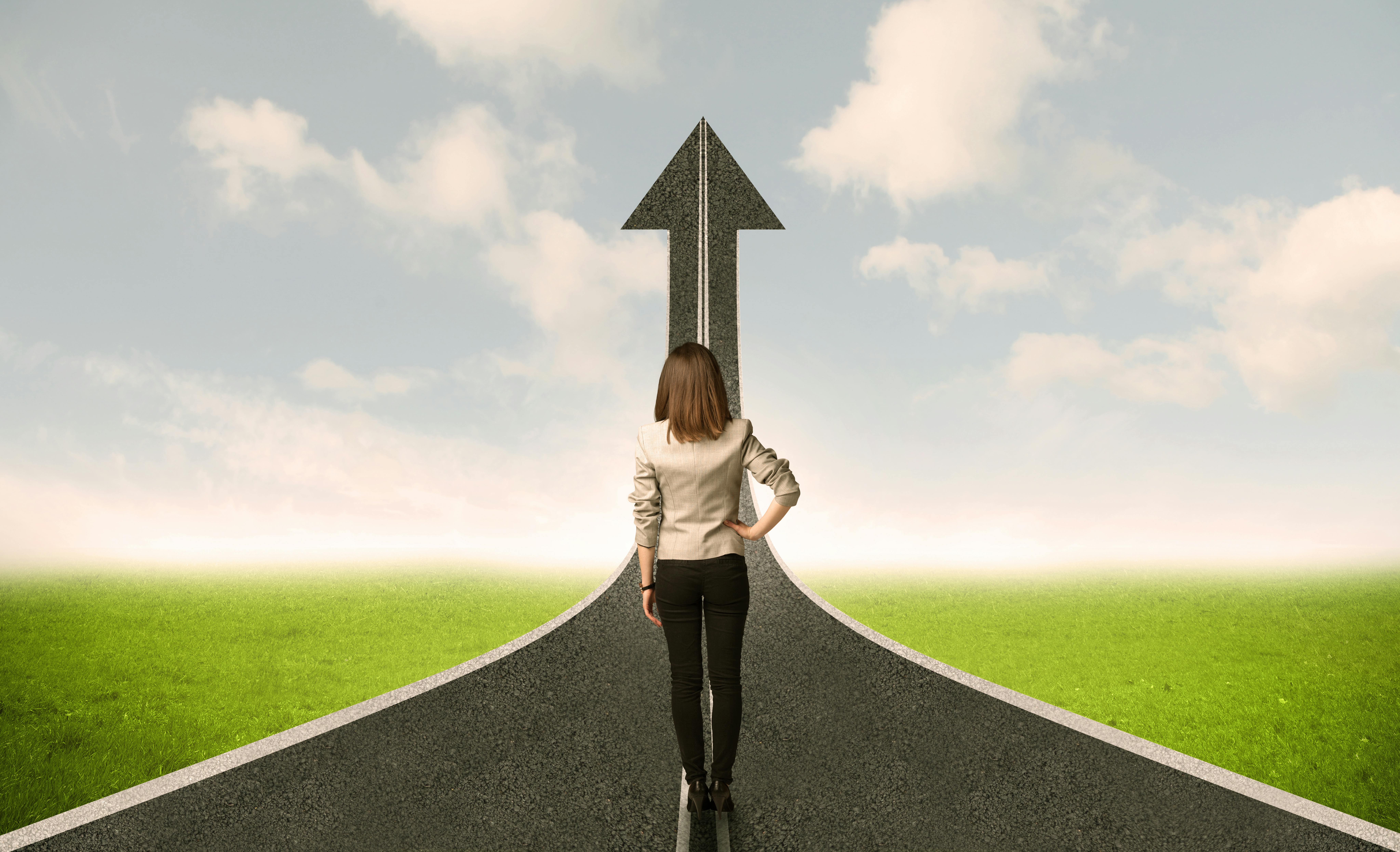 Professional looking at an uphill road