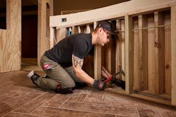 Worker Wearing Bump Cap in Confined Space Worker Wearing Bump Cap in Confined Space