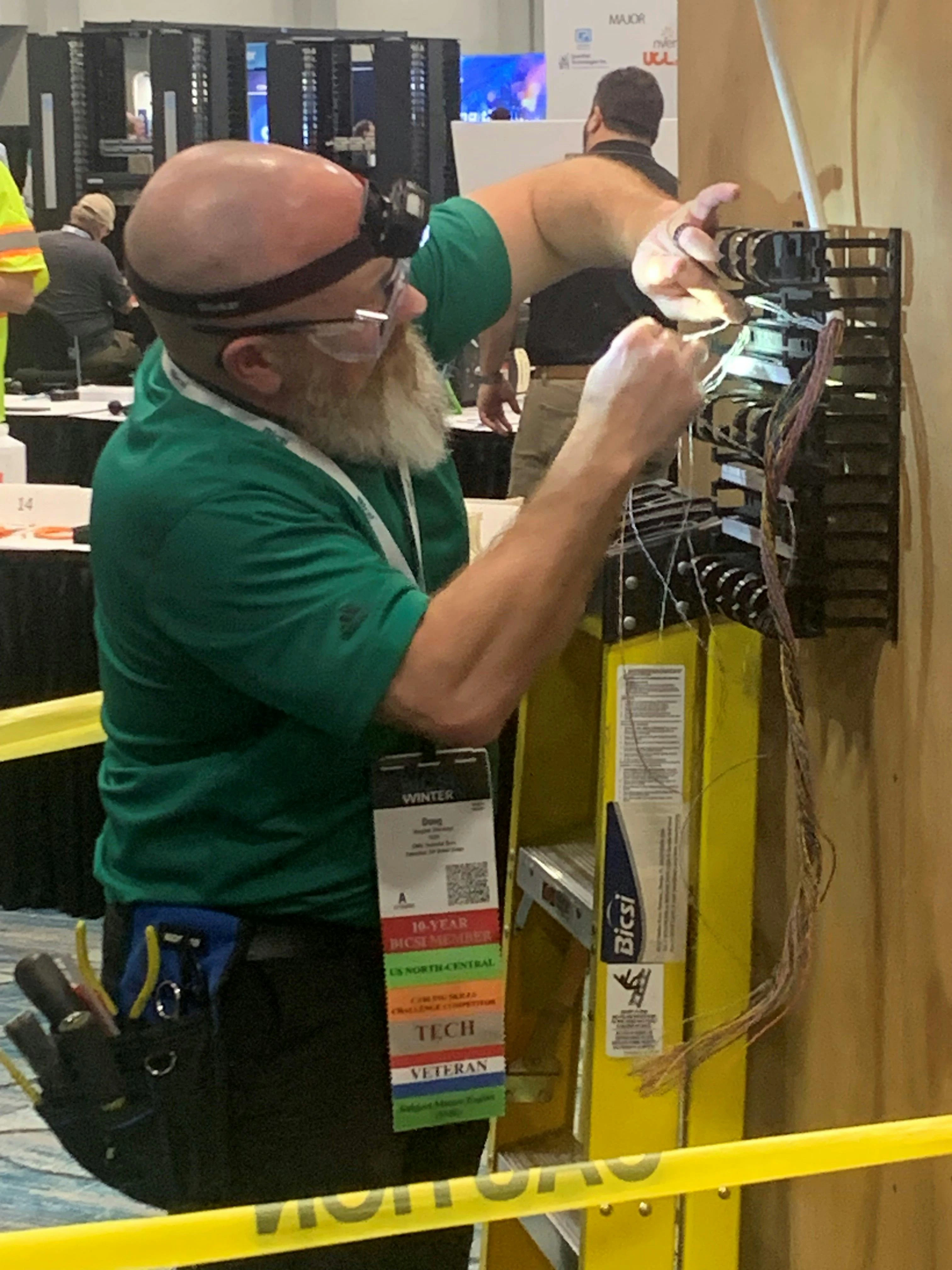 Eventual repeat champion Douglas Sherwood competes during the Cabling Skills Challenge in January 2026. During his acceptance speech after being crowned Installer of the Year, Sherwood called on other industry professionals to make the effort to compete in the 2027 event. He also called on his peers to help the industry by volunteering their time and talents.