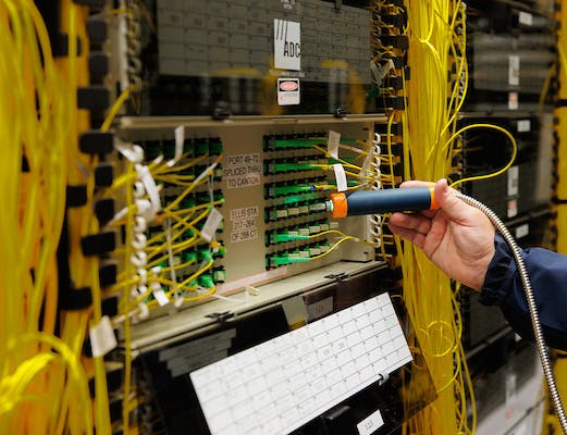 Automated, contactless cleaning systems typically use a two-stage process, combining a metered application of optical-grade cleaning fluid with pressurized air.
